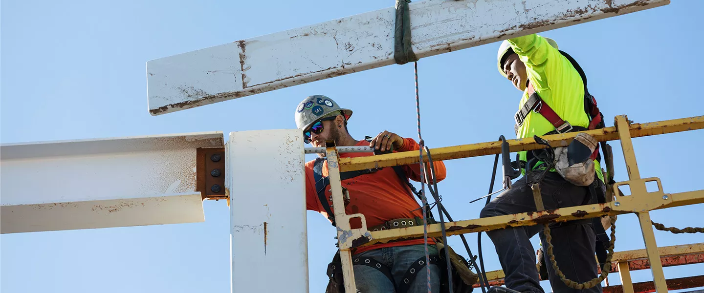 two ironworkers on construction site