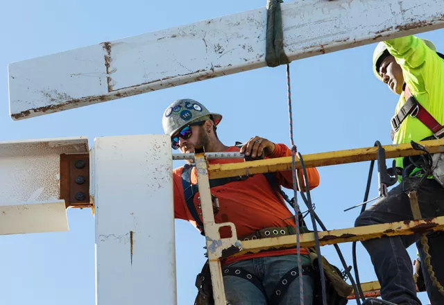 two ironworkers on construction site