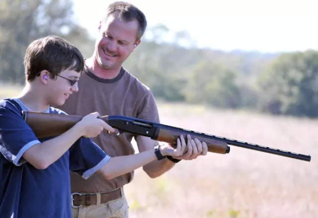 father-instructing-son-on-proper-gun-safety.jpg